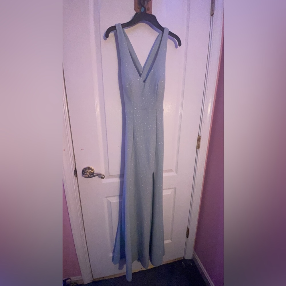 Prom dress worn one time for 2 hours. Fitted only to sinch the waist by 1 inch